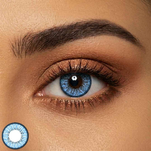 Close-up of a person's eye with adult blue contact lens.