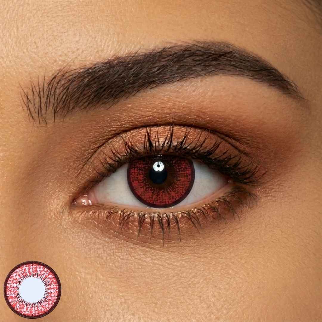 Close-up of a person's eye with a red contact lens