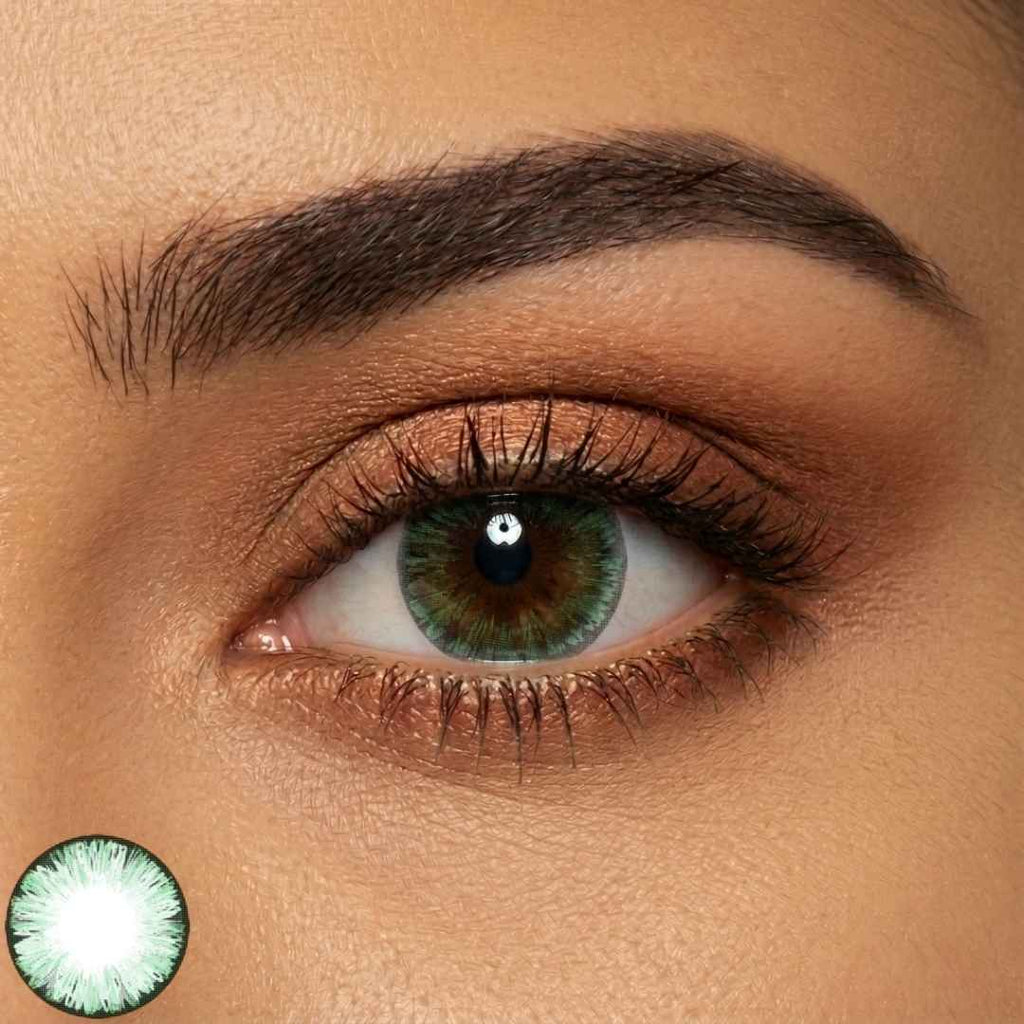 Close-up of a person's eye with wearing mirage green contact lenses