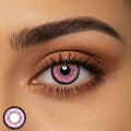 close up of single eye wearing dolly eye pink contact lenses